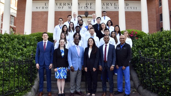 2023-2024 otorhinolaryngology residents, leadership and faculty in front of Davidge Hall